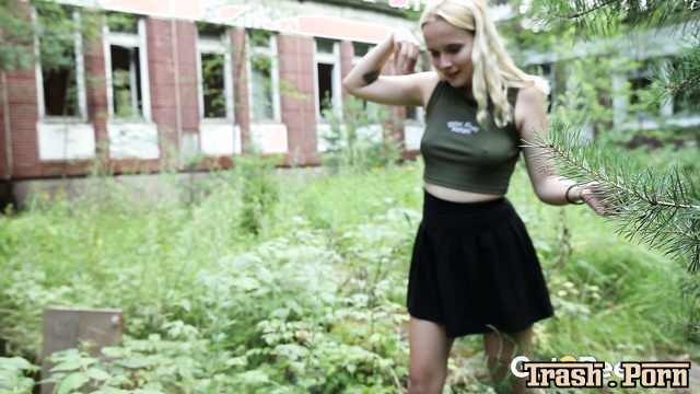 Young blonde pissing in the street with a tampon inside