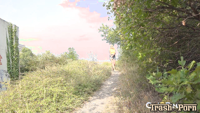 Blonde with shaved pussy pissing on a country road