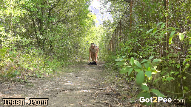 Blonde took off her shorts and peed on a forest path