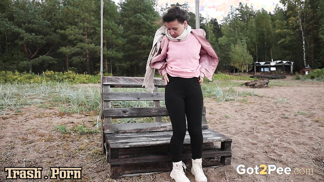 Without thinking twice, she sat down on the bench and peed