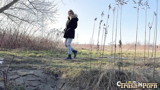 Under the stream of her urine (woman pissing outdoors)