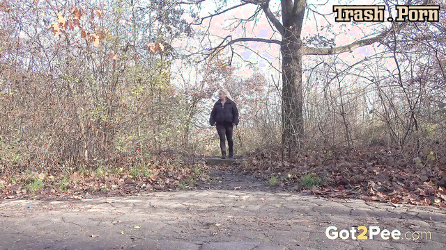 Pretty blonde pissing in Ugg boots in the autumn forest