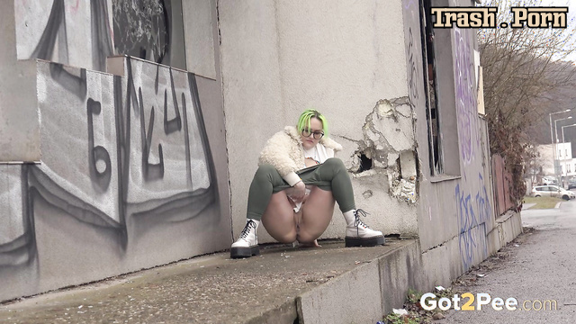 Public pee next to an abandoned store (she couldn't wait)