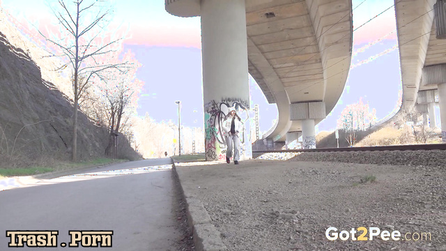 Mini Mitzi – sexy lady pissing  in the middle of the highway
