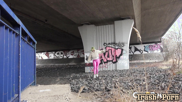 Barbara Bieber pissing on an abandoned railroad, look
