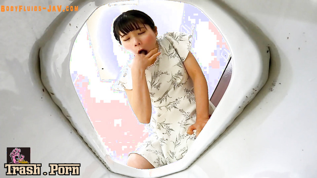 Young asian girl got car sick and she vomited in a public toilet